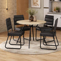 Conjunto de jantar San Francisco com mesa redonda off white e 4 cadeiras em napa preta, ambientado com tapete redondo