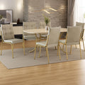 Conjunto de jantar Madrid com mesa retangular off white e 6 cadeiras estofadas, ambientado com tapete e vaso de planta