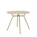 Mesa de jantar redonda 1588 Carraro com tampo off white e estrutura dourada de pés inclinados, vista em ângulo
